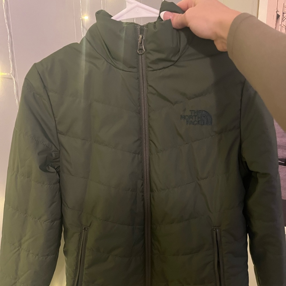 Brand new north face jacket size Xs but can fit a small